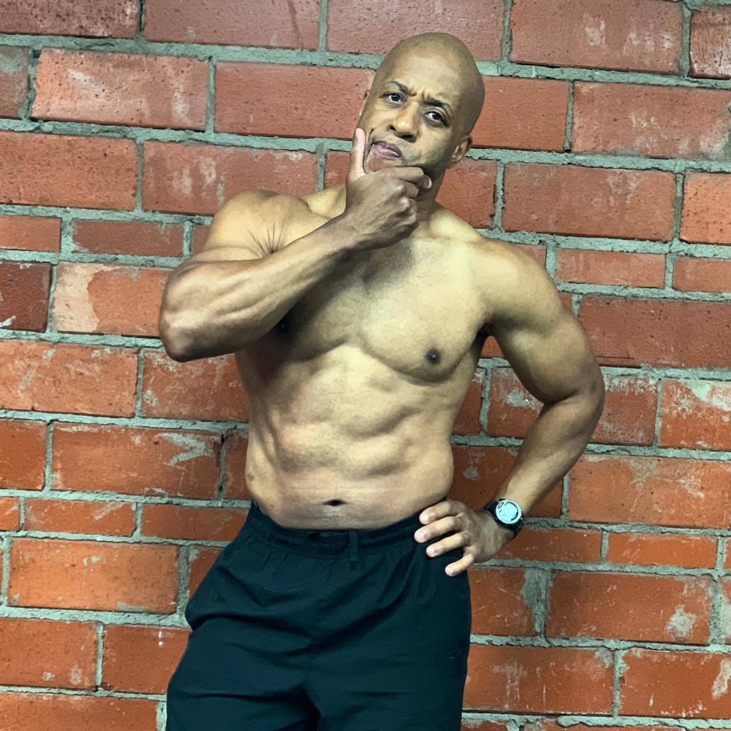 Coach Chris showing his physique